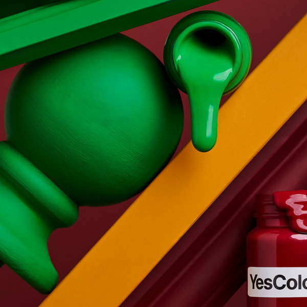 a vertically arranged collection of paint sample jars and painting accessories and tools, photographed on a bold dark red background